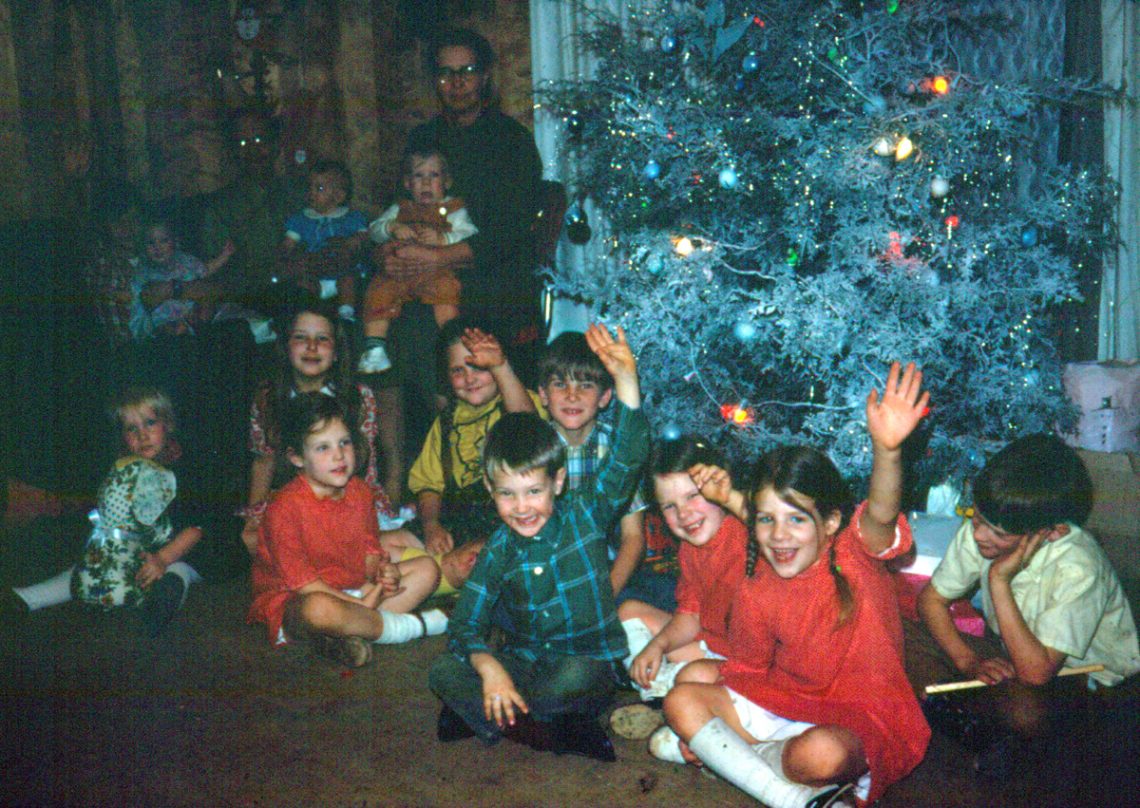 children in front of Christmas tree 1971